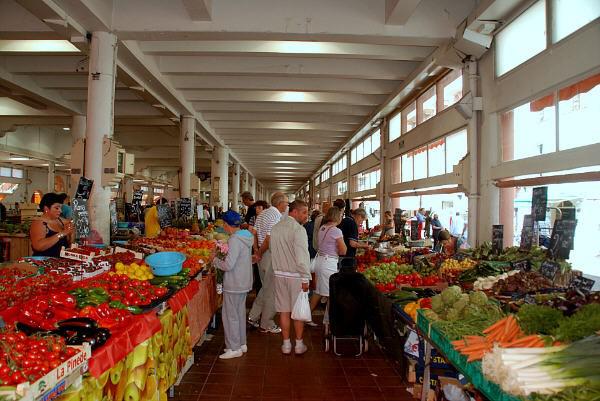 Fresh produce stalls inside Forville Market in Cannes